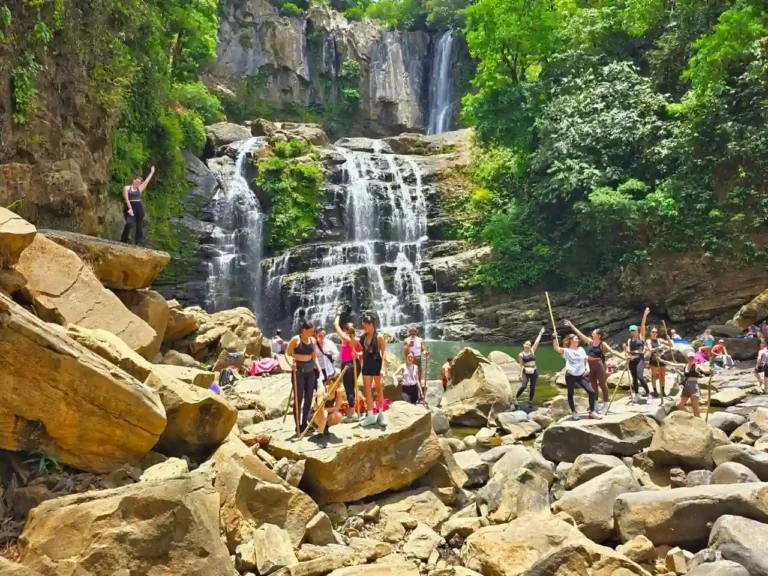 nauyaca falls with people ejoying the tour