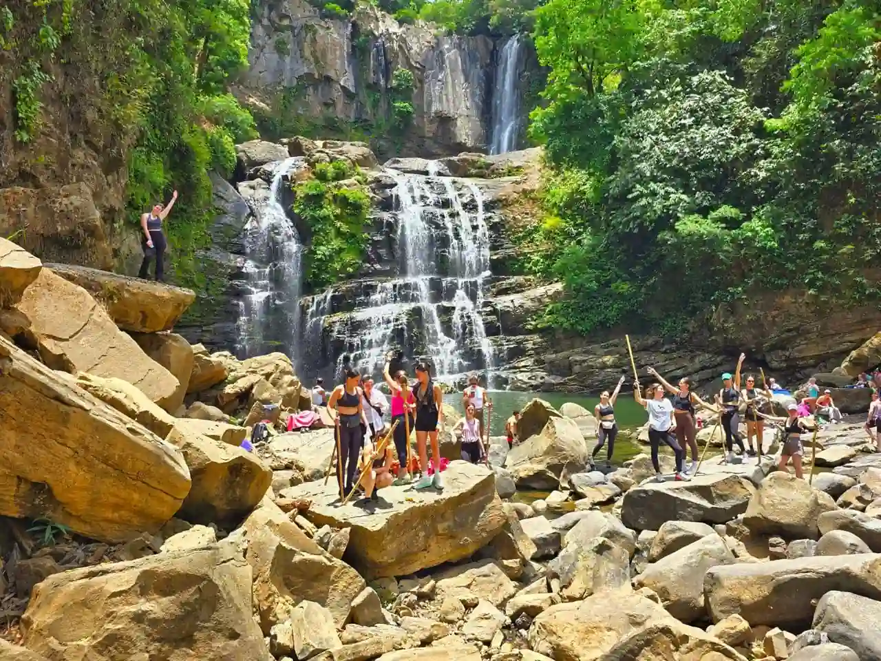 nauyaca falls with people ejoying the tour