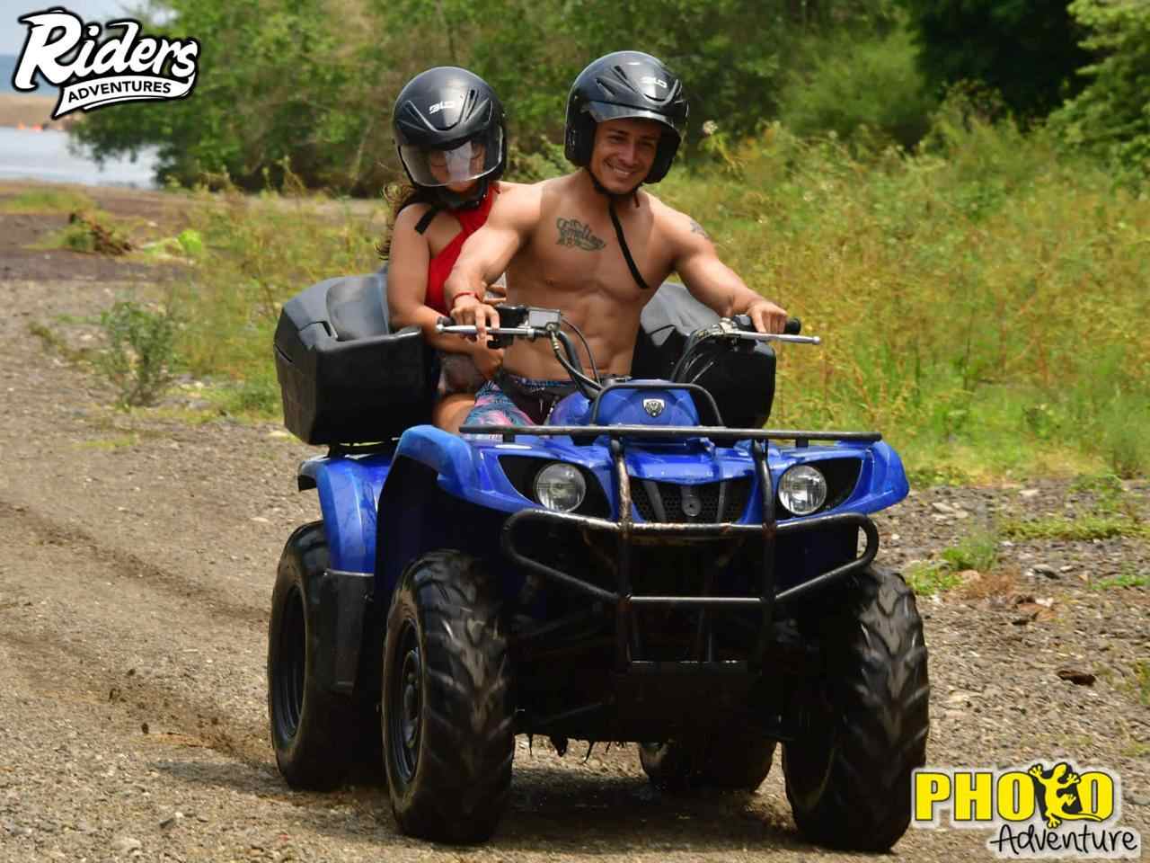 couple driving atv in tour