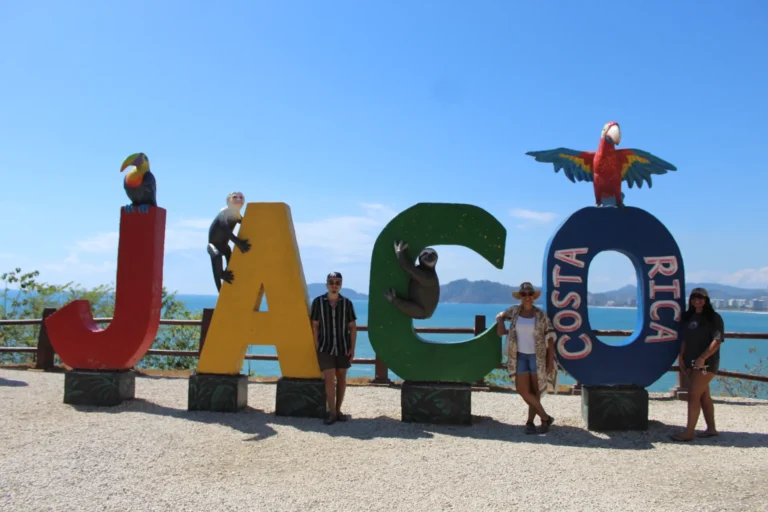 Family enjoying a trip in Jaco Costa Rica at the iconic Jaco sign