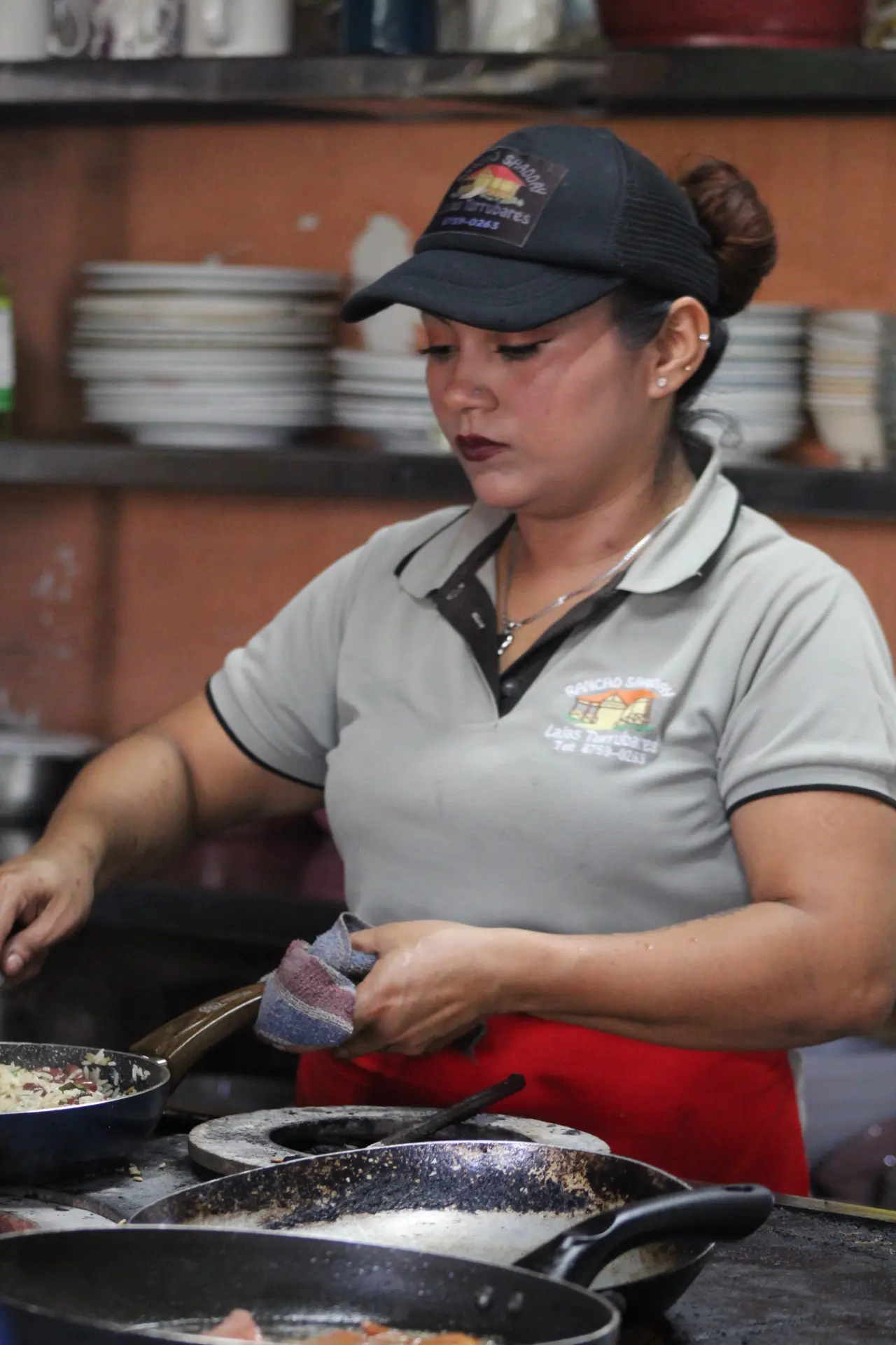 Local chef preparing traditional Costa Rican food during a Jaco culinary experience tour