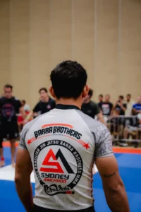 Jiu Jitsu competitor wearing Gracie Barra rashguard preparing for match