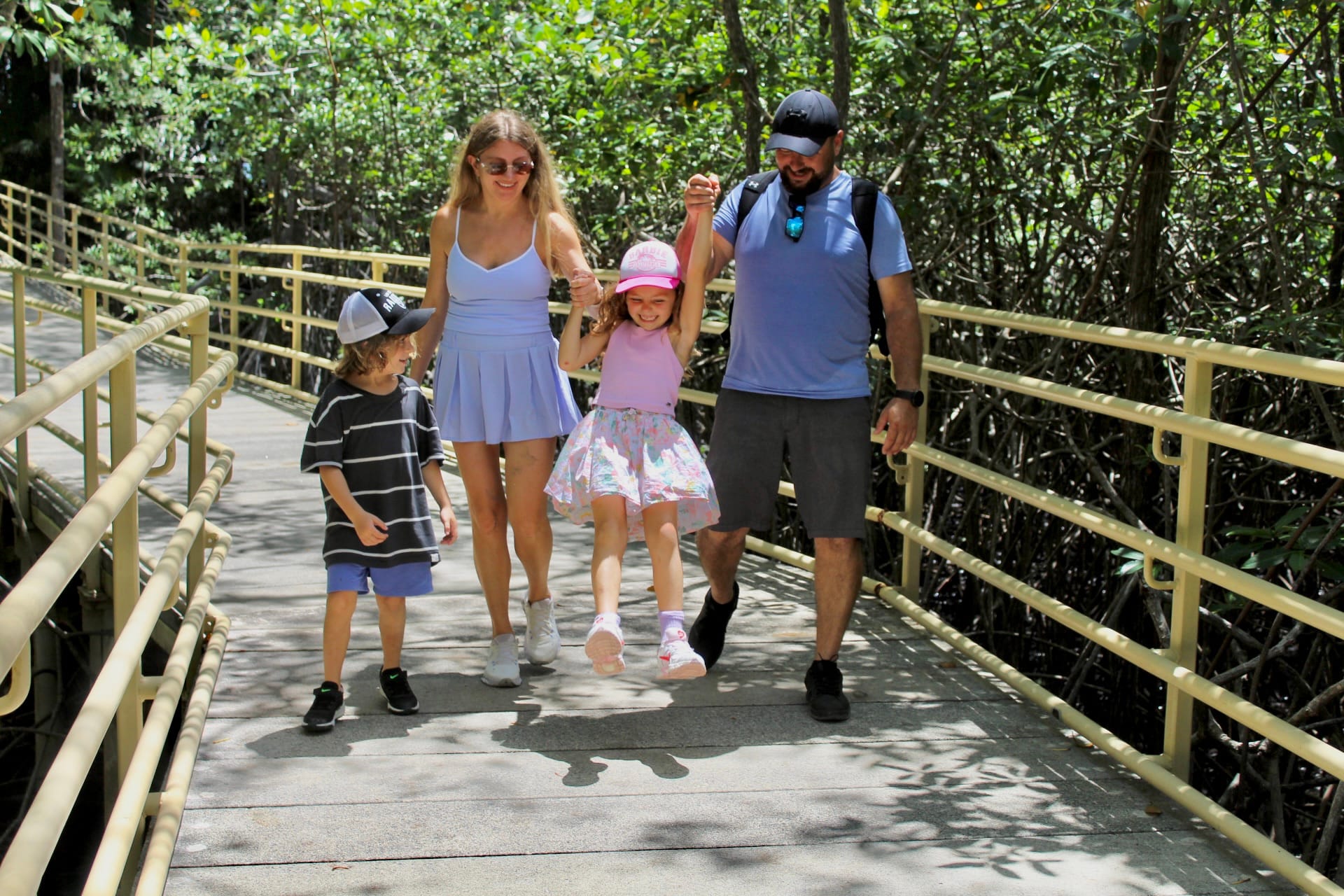 Family exploring a nature trail in Manuel Antonio National Park near Jaco Costa Rica