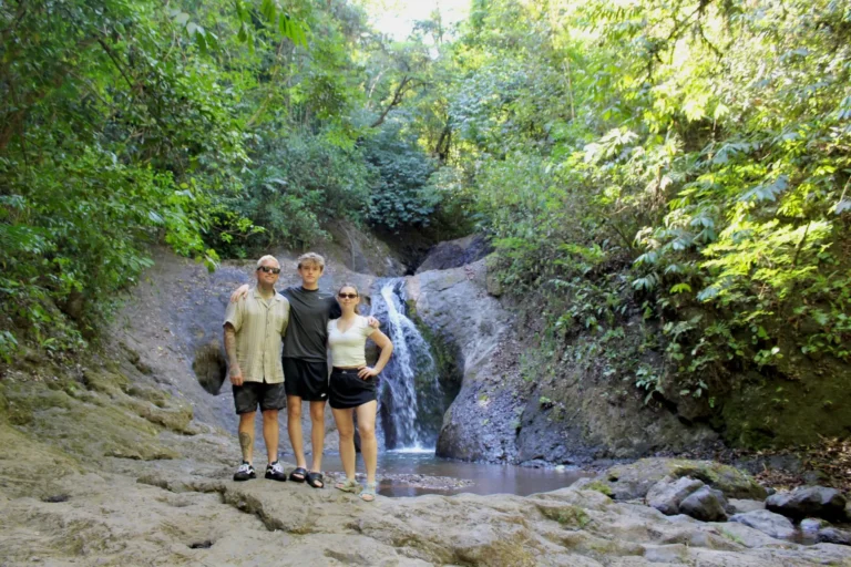 Family enjoying a waterfall in Jaco Costa Rica during a nature experience