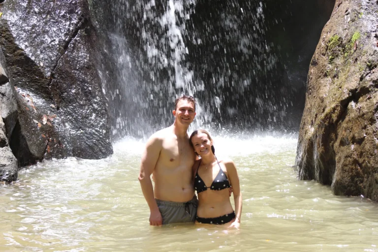 Couple enjoying a waterfall experience near Jaco Costa Rica during a romantic getaway