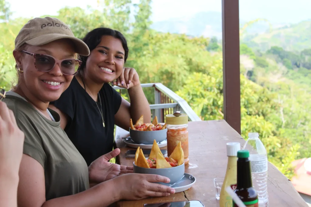 Travelers enjoying a meal at a mountain restaurant near Jaco Costa Rica during a guided tour