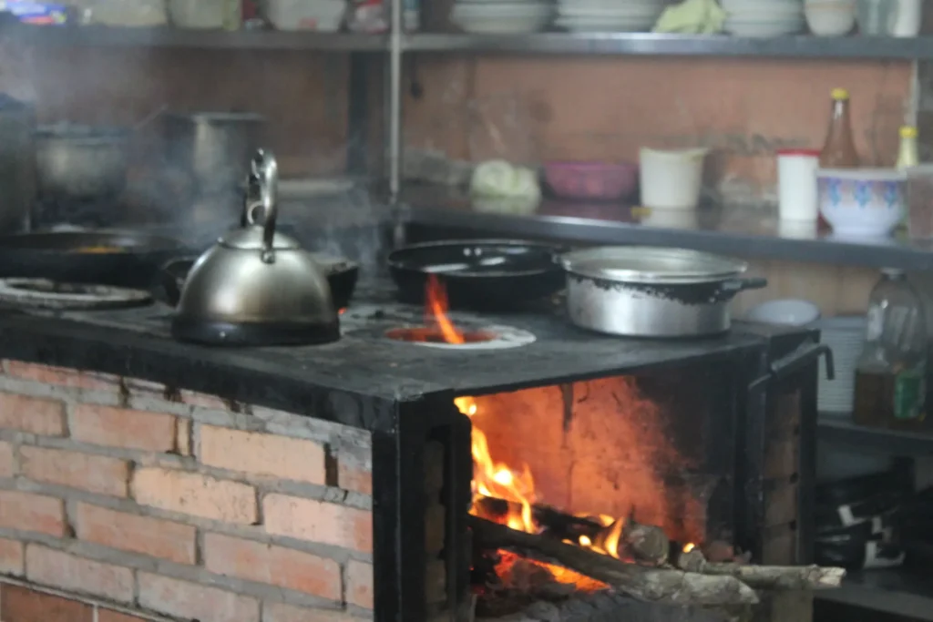Traditional Costa Rican cooking on a wood stove during a mountain culinary experience near Jaco