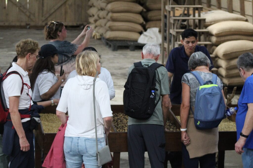 Group learning about coffee production at Doka Coffee Plantation in Costa Rica