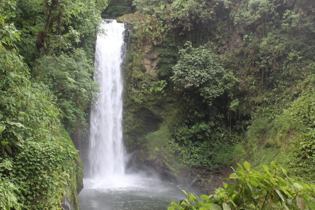 La Paz Waterfall near Poas Volcano in Costa Rica surrounded by lush rainforest