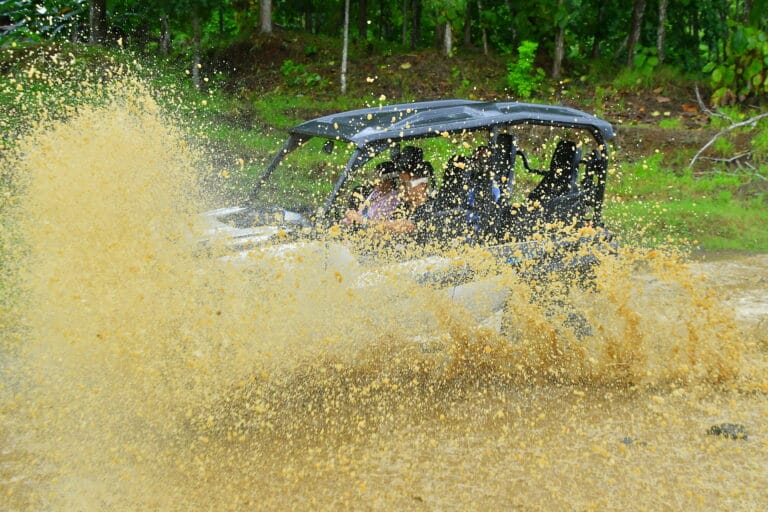 ATV riding through muddy trails during the rainy season in Jaco, Costa Rica