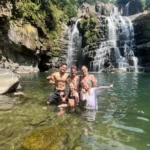 nauyaca waterfall people in water