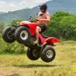 atv driver jumping in atv
