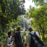 Group of turist taking picture of Nauyaca waterfall