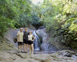 Family enjoying a hidden waterfall near Jaco Costa Rica