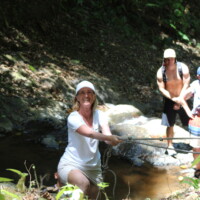 Group hiking through the rainforest during a Jaco Waterfall Tour