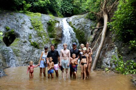 Travelers enjoying a guided waterfall experience near Jaco