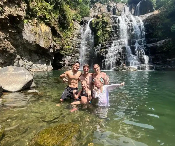 nauyaca waterfall people in water