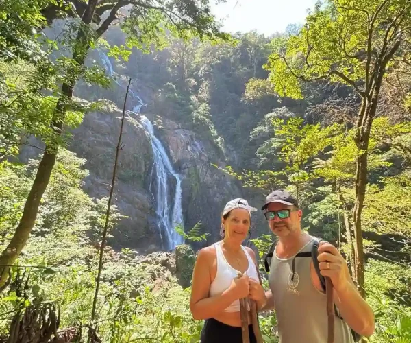 bijagual waterfall view from trail with a couple posing