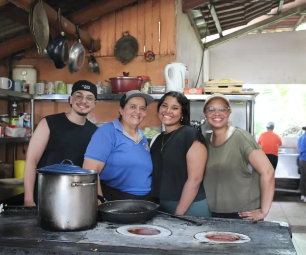 Group enjoying a traditional Costa Rican cooking experience during a Jaco culinary tour