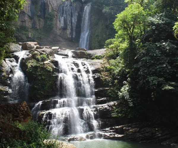 Visitors enjoying Nauyaca Waterfalls in Costa Rica during a guided tour