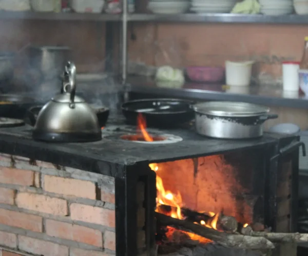 Traditional Costa Rican cooking on a wood stove during a mountain culinary experience near Jaco